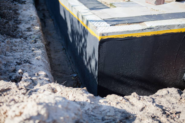 Professional Basement Waterproofing technician working in Folsom, PA